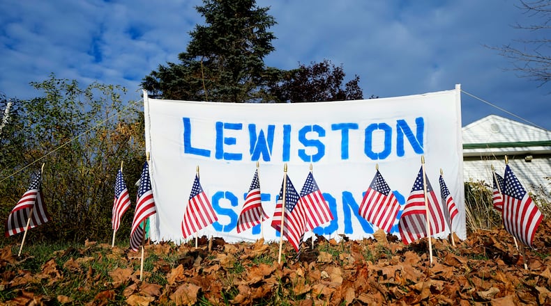 FILE - A make-shift memorial lines Main Street following a deadly mass shooting in Maine, Nov. 3, 2023, in Lewiston, Maine. (AP Photo/Matt York, File)