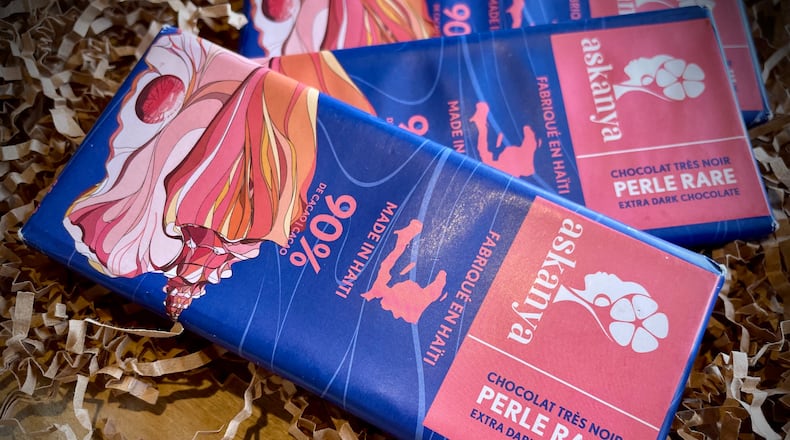 London Coe, the owner of Peace on Fifth who regularly sets up at 2nd Street Market in downtown Dayton, features single origin, bean to bar, ethically sourced craft chocolate from across the globe. NATALIE JONES/STAFF