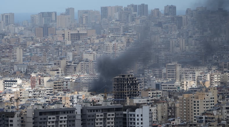 Smoke rises following an Israeli airstrike in Dahiyeh, Beirut's southern suburbs, Lebanon, Monday, March 30, 2026. (AP Photo/Bilal Hussein)