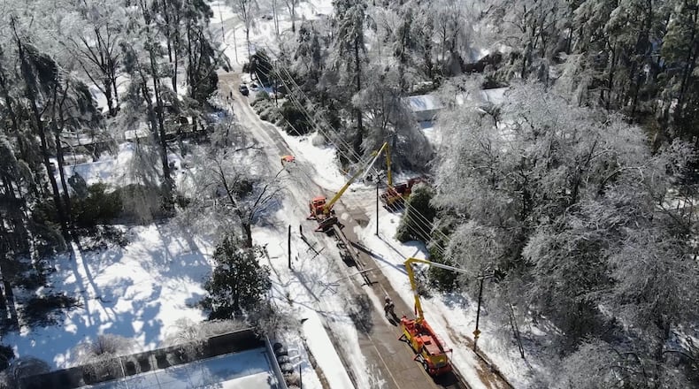 This image taken from a video released by the city of Oxford, Miss., shows crews working on power lines Tuesday, Jan. 27, 2026. (City of Oxford Mississippi via AP)