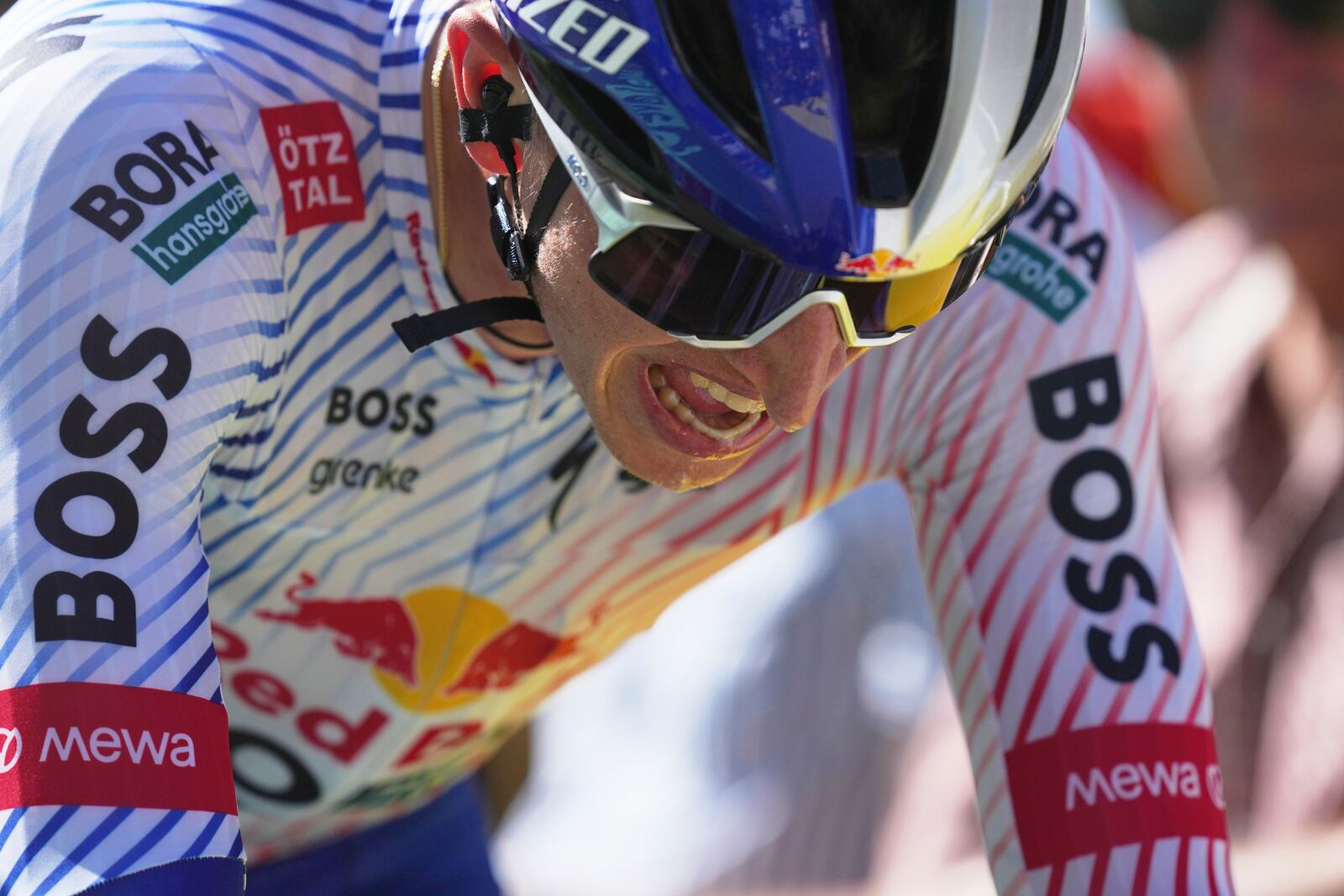 Germany's Florian Lipowitz strains during the thirteenth stage of the Tour de France cycling race, an individual time-trial over 10.5 kilometers (6.5 miles) in the Pyrenees mountains with start in Loudenvielle and finish in Peyragudes, France, Friday, July 18, 2025. (AP Photo/Thibault Camus)