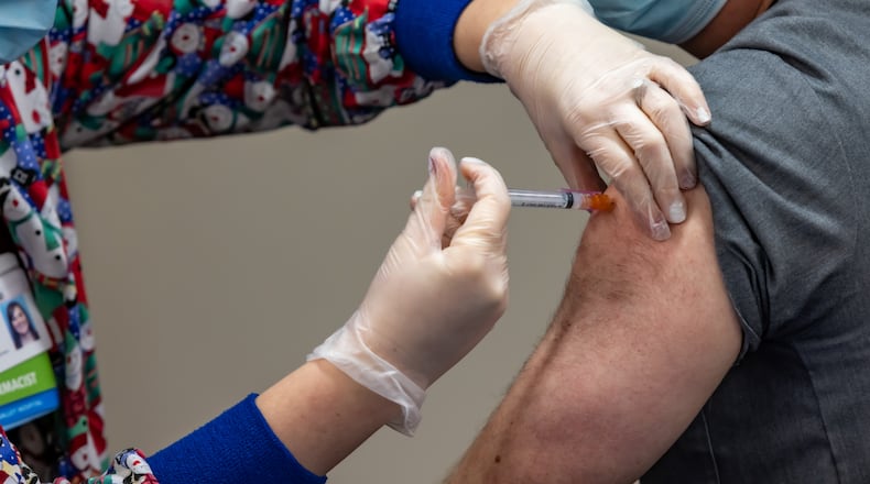 The first dose of the Moderna coronavirus vaccine (a two-dose regimen) is administered to frontline health care workers at Miami Valley Hospital. Photo provided by Premier Health.