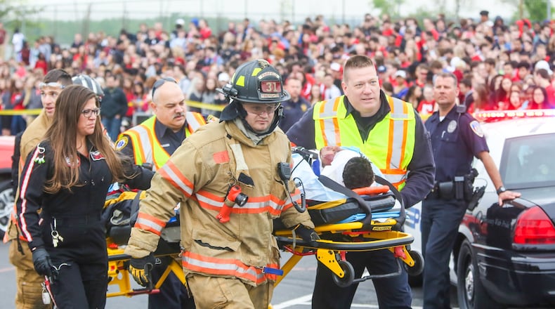 State and local emergency response agencies will conduct a mass-fatality exercise Friday similar to this mock crash exercise last month at Fairfield High School. GREG LYNCH / STAFF