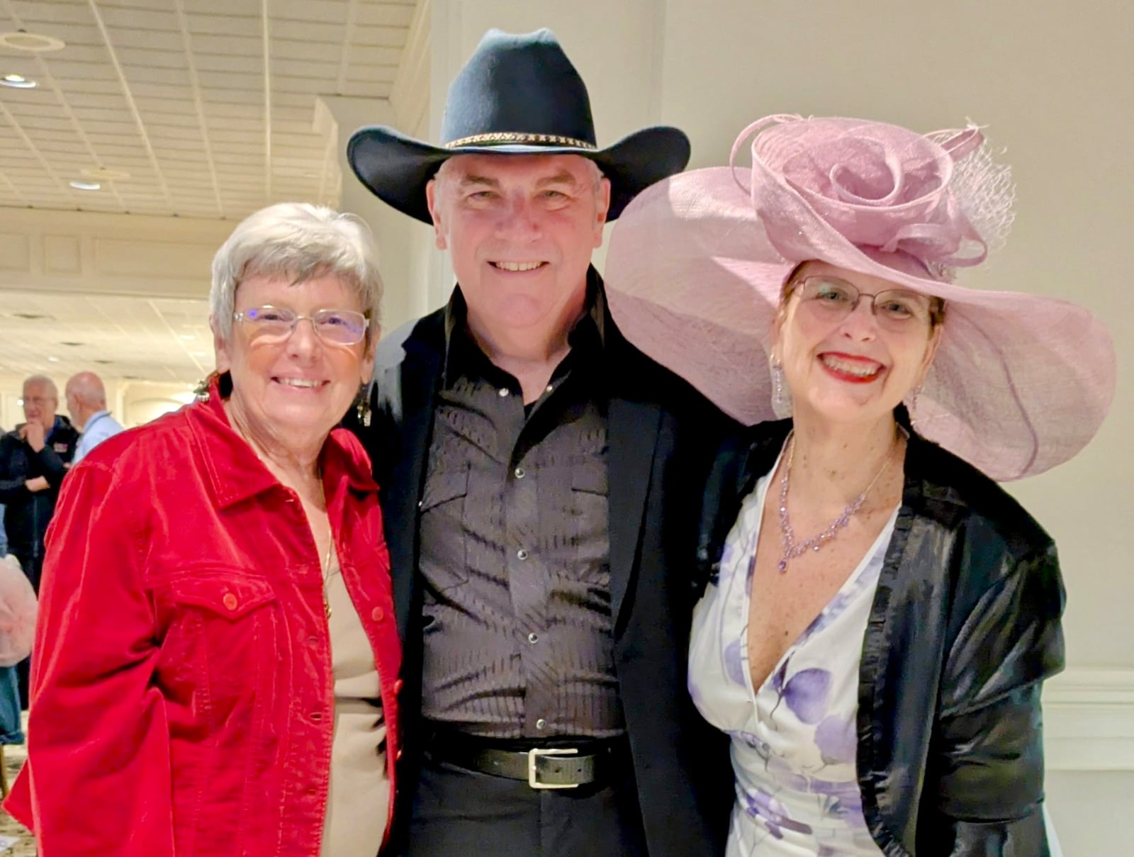 Terry Schalnat (left), Dan Edwards (middle) and Katie Neuman (right) enjoy We Care Arts' annual evening at the races event the week before the Kentucky Derby. PROVIDED