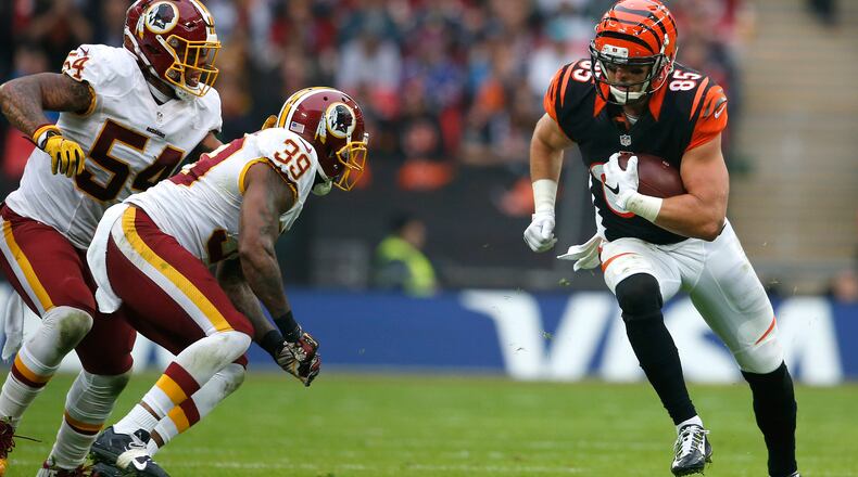 LONDON, ENGLAND - OCTOBER 30: Tyler Eifert #85 of the Cincinnati Bengals rushes the ball against Donte Whitner Sr. #39 and Mason Foster #54 of the Washington Redskins during the NFL International Series game at Wembley Stadium on October 30, 2016 in London, England. (Photo by Alan Crowhurst/Getty Images)
