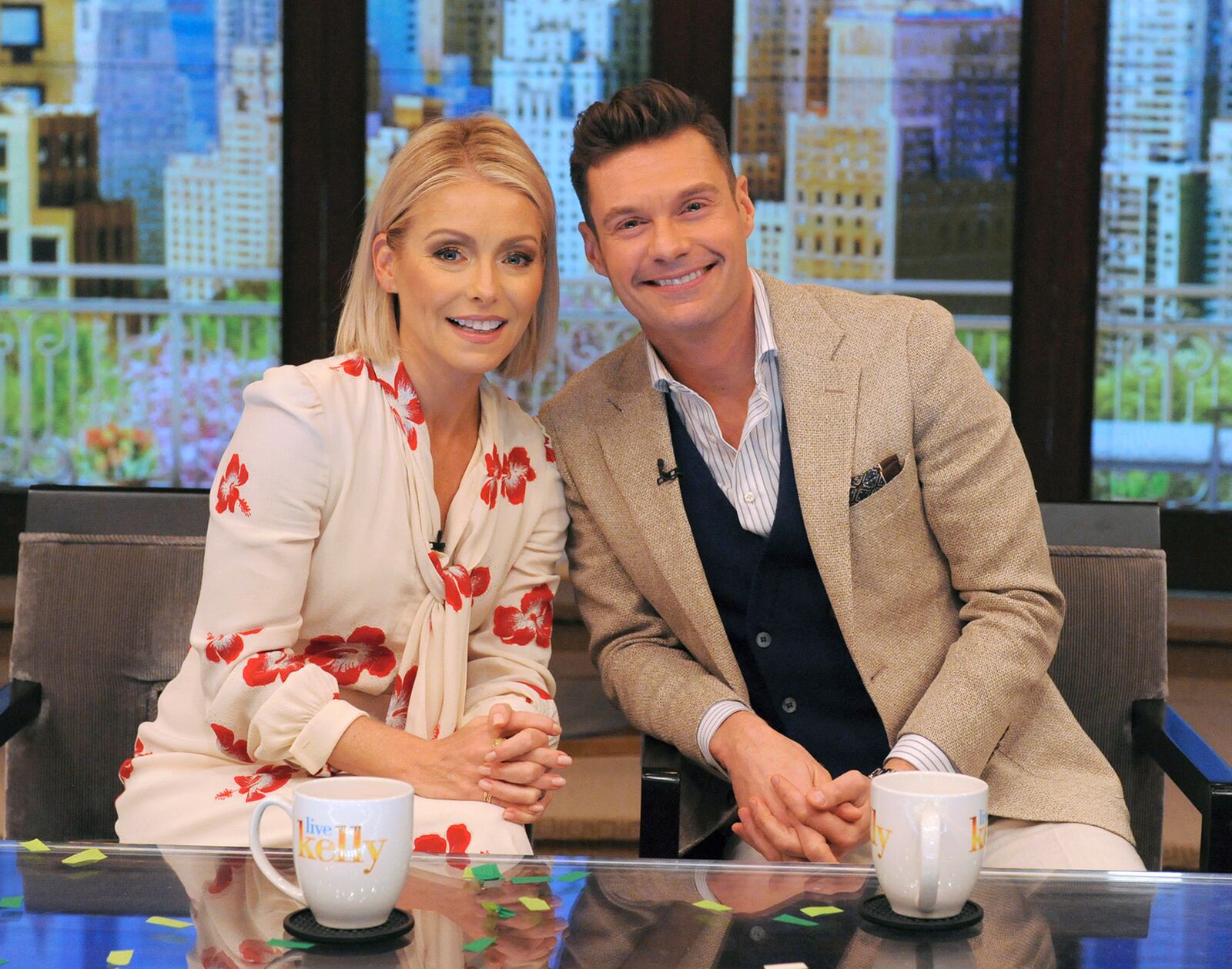 In this photo released by Disney/ABC Home Entertainment and TV Distribution, Kelly Ripa and Ryan Seacrest pose for a photo at "Live" on Monday, May 1, 2017, in New York. Seacrest was named co-host of the morning chat show, ending a yearlong search for a marquee name as Michael Strahan's successor. (Pawel Kaminski/Disney/ABC Home Entertainment and TV Distribution via AP)