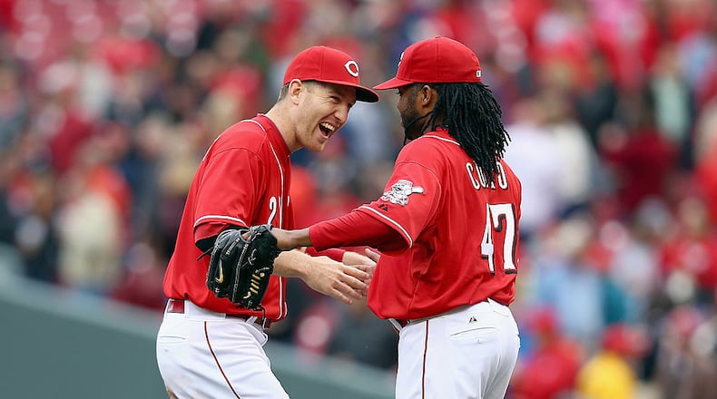CINCINNATI, OH - MAY 15: Todd Frazier #21 and Johnny Cueto #47 of the Cincinnati Reds celebrate after the Reds 5-0 win in the first game of a doubleheader against the San Diego Padres at Great American Ball Park on May 15, 2014 in Cincinnati, Ohio. Cueto pitched a complete game shutout. (Photo by Andy Lyons/Getty Images)