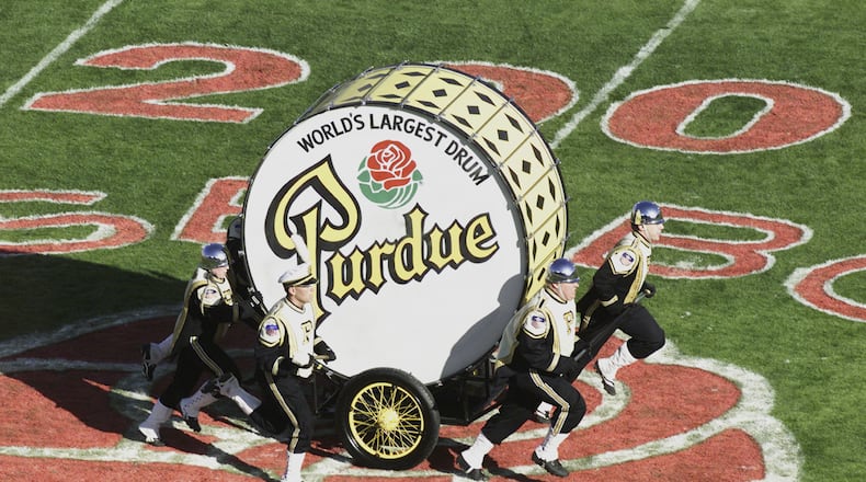 PASADENA, CA - JANUARY 1:  Members of the Purdue Boilermakers band pull the World's Largest Drum on the field during halftime of the game against the Washington Huskies on January 1, 2001 at the Rose Bowl in Pasadena, California.  Washington defeated Purdue 34-24.  (Photo by Donald Miralle/Getty Images)
