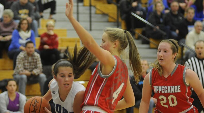 Springboro’s Jordan Diehl (with ball) is checked by Tipp’s Taylor Prall. Springboro defeated visiting Tippecanoe 50-36 in a girls high school basketball game on Sat., Jan. 7, 2017. MARC PENDLETON / STAFF