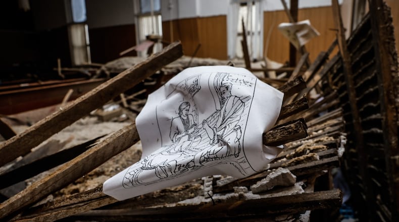 New Beginnings Fellowship Church on Fletcher Chapel Road was heavy damaged Wednesday morning. The roof is collapsed onto the pews and block the main entrance. JIM NOELKER/STAFF