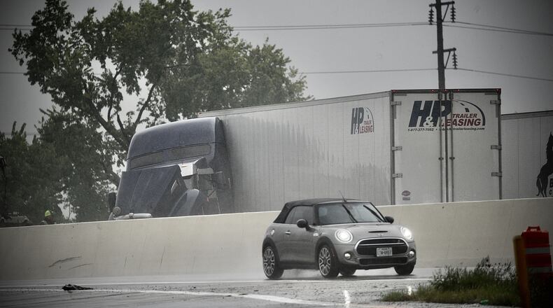 A Jackknifed semi truck northbound on I-75 past the Stanley Street exit in Dayton caused traffic backed up Tuesday, Aug. 31, 2021. MARSHALL GORBY\STAFF