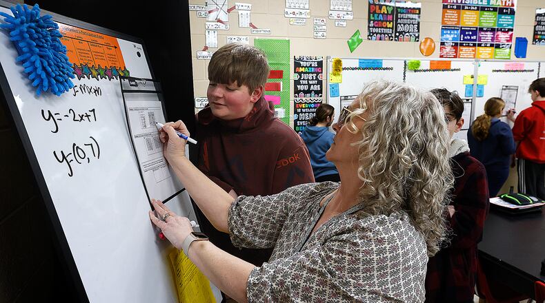 New Lebanon eighth-grade math teacher Ronda Nisbet works with her students during a math class.  MARSHALL GORBY\STAFF