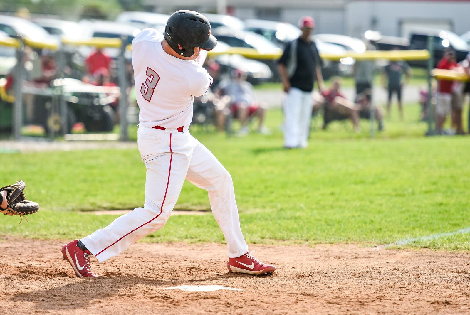 Carlisle’s Dane Flatter connects for a three-run double during the second inning of Wednesday’s Division III sectional game at Sam Franks Field in Carlisle. NICK GRAHAM/STAFF