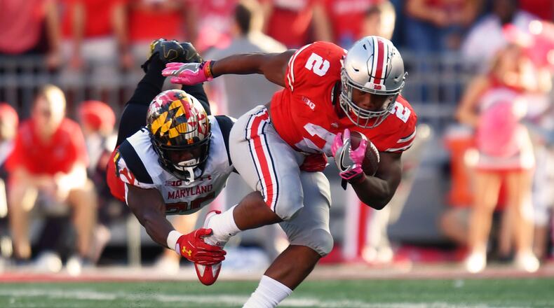 COLUMBUS, OH - OCTOBER 7: Antoine Brooks #25 of the Maryland Terrapins hangs on to make the tackle on J.K. Dobbins #2 of the Ohio State Buckeyes in the second quarter after a run at Ohio Stadium on October 7, 2017 in Columbus, Ohio. (Photo by Jamie Sabau/Getty Images)