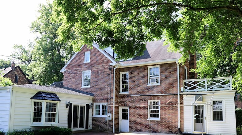 A family room addition off the back of the brick 2-story is designed as a recreation room with wet bar area, fireplace, bay window and patio access. The walk-up attic has been finished into 2 rooms.