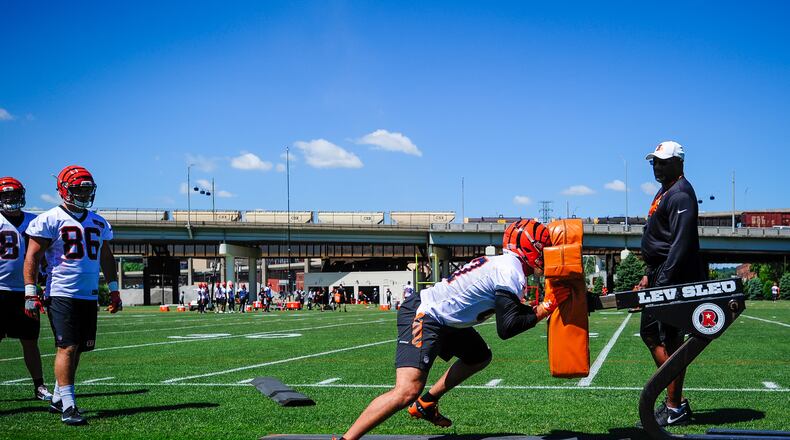 Cincinnati Bengals players run through drills during practice Tuesday, June 6 on their practice fields next to Paul Brown Stadium in Cincinnati. NICK GRAHAM/STAFF