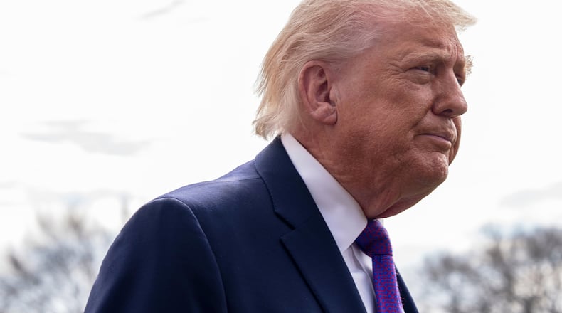 President Donald Trump speaks with reporters before departing on Marine One from the South Lawn of the White House, Wednesday, March 11, 2026, in Washington. (AP Photo/Alex Brandon)