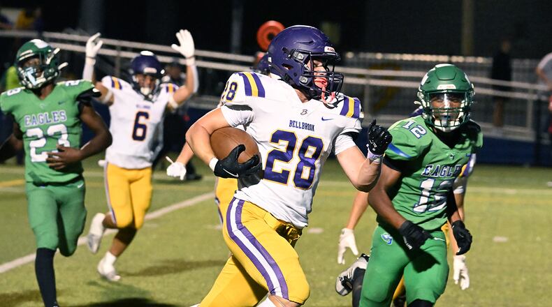 Bellbrook High School freshman Bryce Elmeier runs past Chaminade Julienne sophomore Kayden Greene-Paschal during their 41-0 over the Eagles on Friday night at Roger Glass Stadium in Dayton. NICK FALZERANO/CONTRIBUTED PHOTO