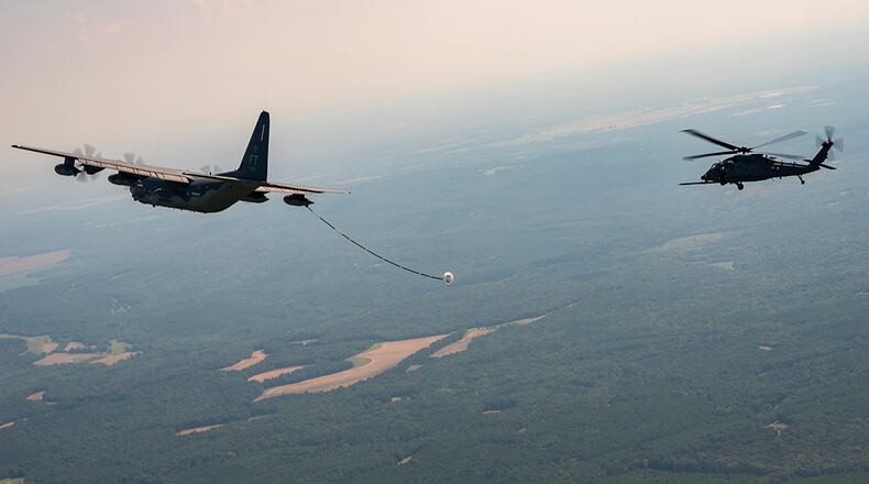 An HH-60W Jolly Green II prepares to connect with an HC-130J tanker for its first aerial refueling over southern Alabama Aug. 5. The Air Force’s newest combat search and rescue helicopter is currently undergoing developmental and operational testing. (U.S. Air Force photo/Master Sgt. Tristan McIntire)