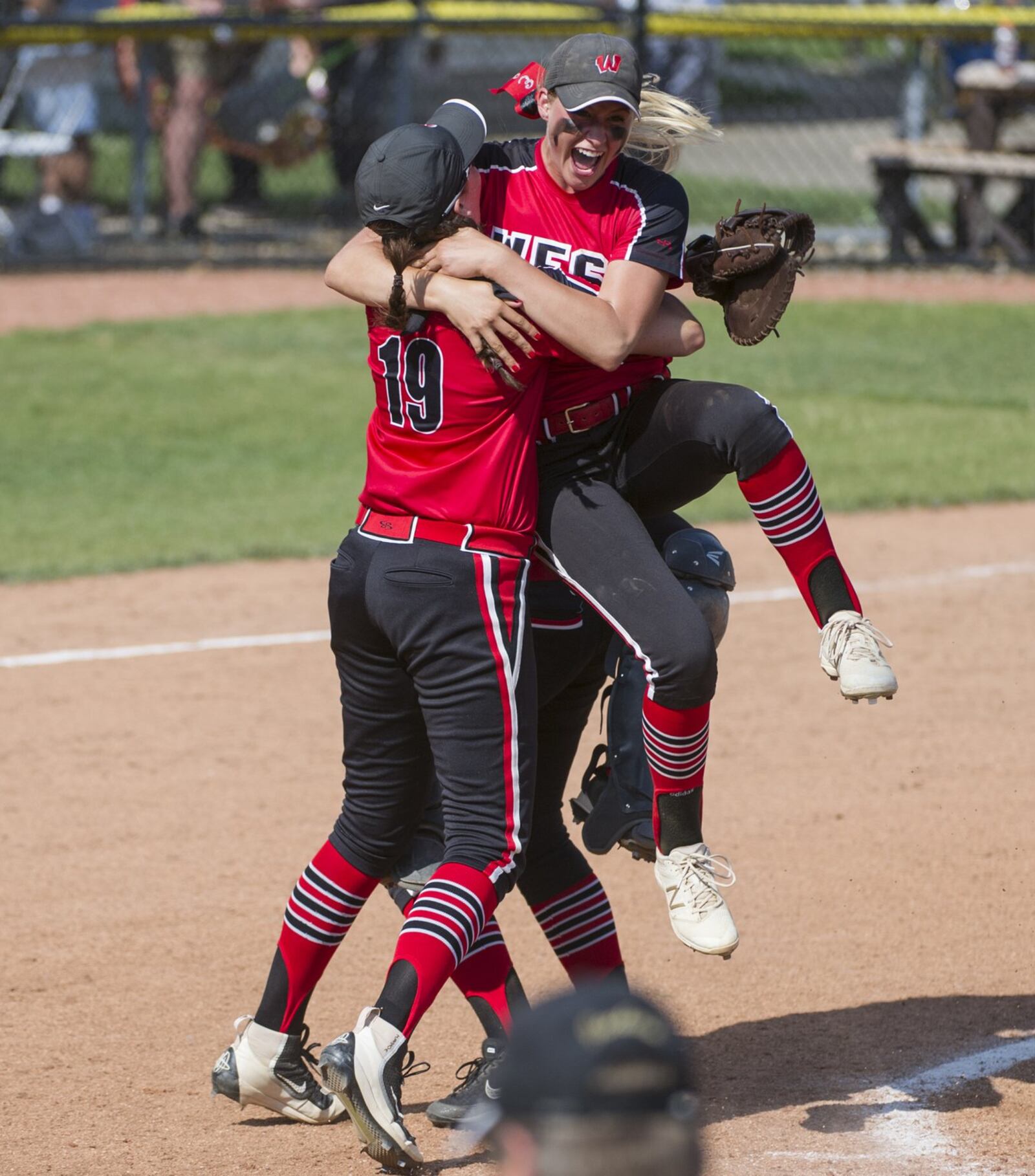 Lakota West’s Cameron Wesley (19) celebrates with Alyssa Triner after the Firebirds defeated Perrysburg 2-1 in a Division I state semifinal at Firestone Stadium in Akron on Thursday afternoon. PHIL LONG/OHIO PRESS PHOTO SYSTEM