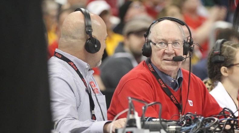 Bucky Bockhorn, right, is honored as he calls a Dayton game against Davidson on WHIO Radio with Larry Hansgen during the Atlantic 10 quarterfinals on Friday, March 10, 2017, at PPG Paints Arena in Pittsburgh.