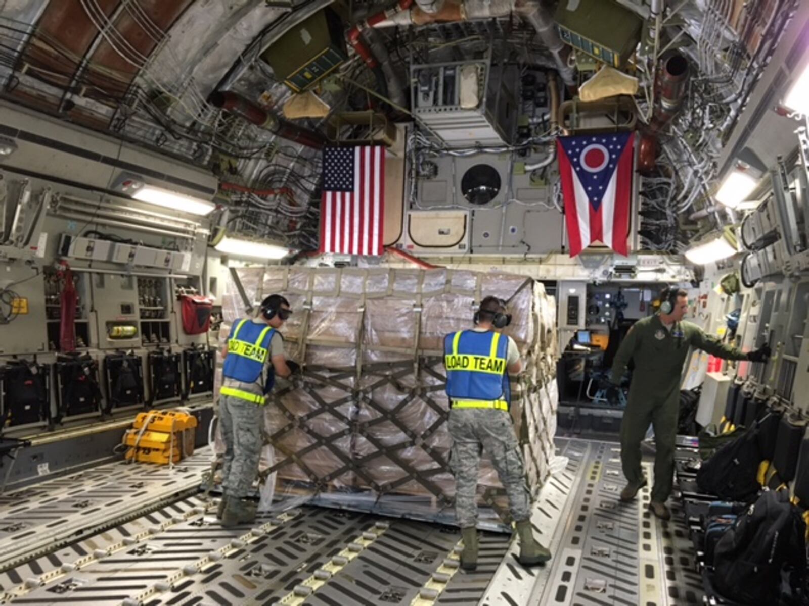 Loadmasters push cargo into place aboard a Wright-Patt Air Force Reserve C-17 that landed at Joint Base McGuire-Dix-Lakehurst, N.J., on its way to Homestead Air Reserve Base, Fla. The crew delivered troops and disaster relief supplies to hard hit Florida after Hurricane Irma. BARRIE BARBER/STAFF