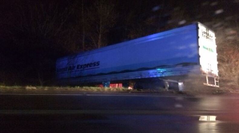 A red cab is shown under its trailer following a crash Sunday night, Dec. 4, 2016, along U.S. 35 near Xenia in Greene County. Contributed