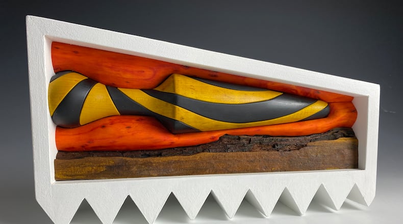 "Relief #225, Landscape with Floating Pestle" by Chet Geiselman is a stained wood sculpture in ‘Height x Width x Depth' at Rosewood Arts Center. CONTRIBUTED