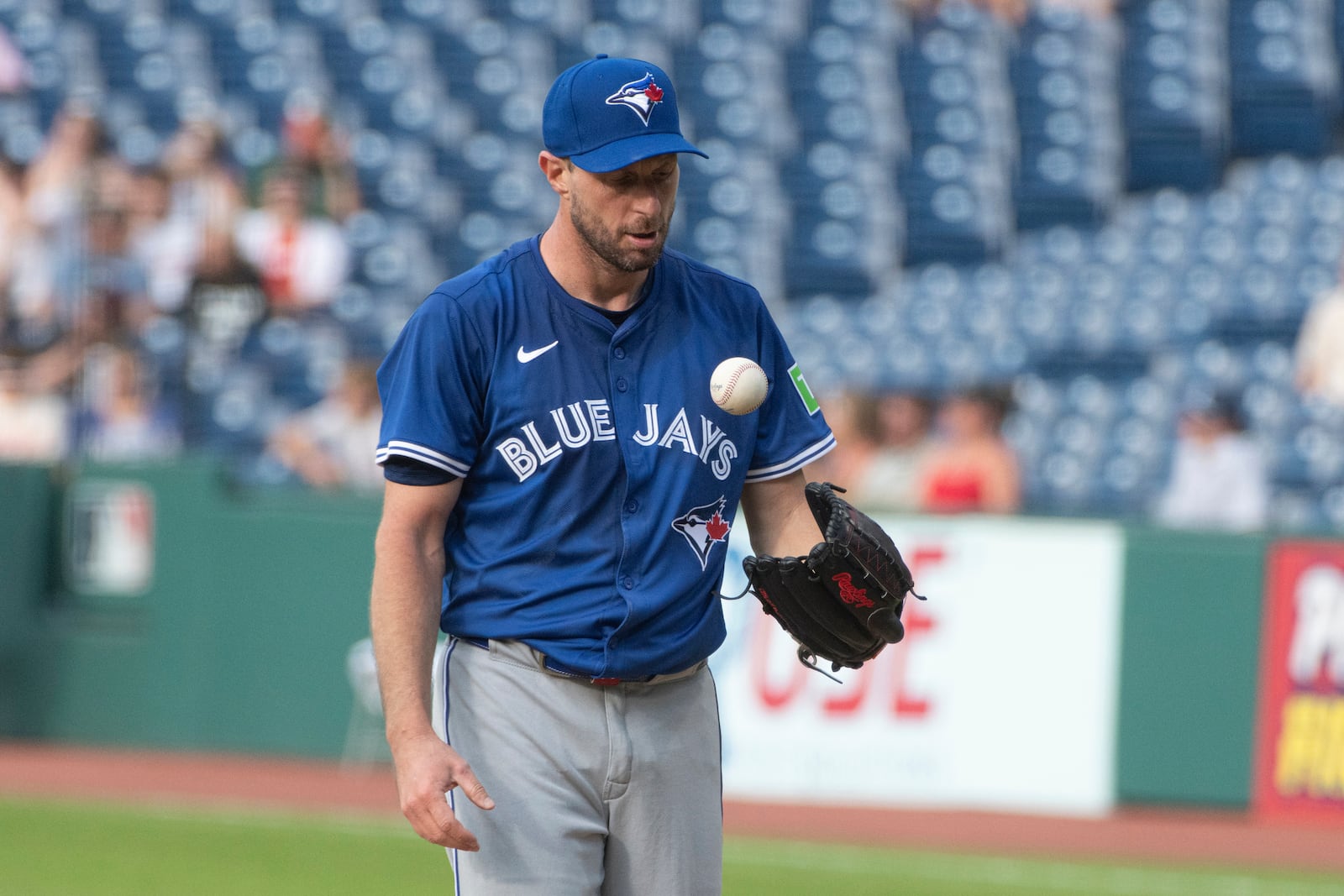 Toronto Blue Jays starting pitcher Max Scherzer pauses between pitches against the Cleveland Guardians during the first inning of a baseball game, Wednesday, June 25, 2025, in Cleveland. (AP Photo/Phil Long)