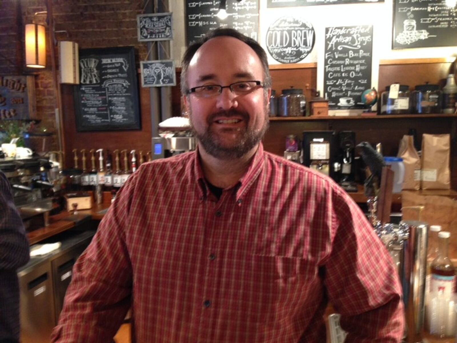 Shane Anderson describes his coffee shop, Dayton’s Ghostlight Coffee, as a bit like a friend’s living room. THOMAS GNAU/STAFF