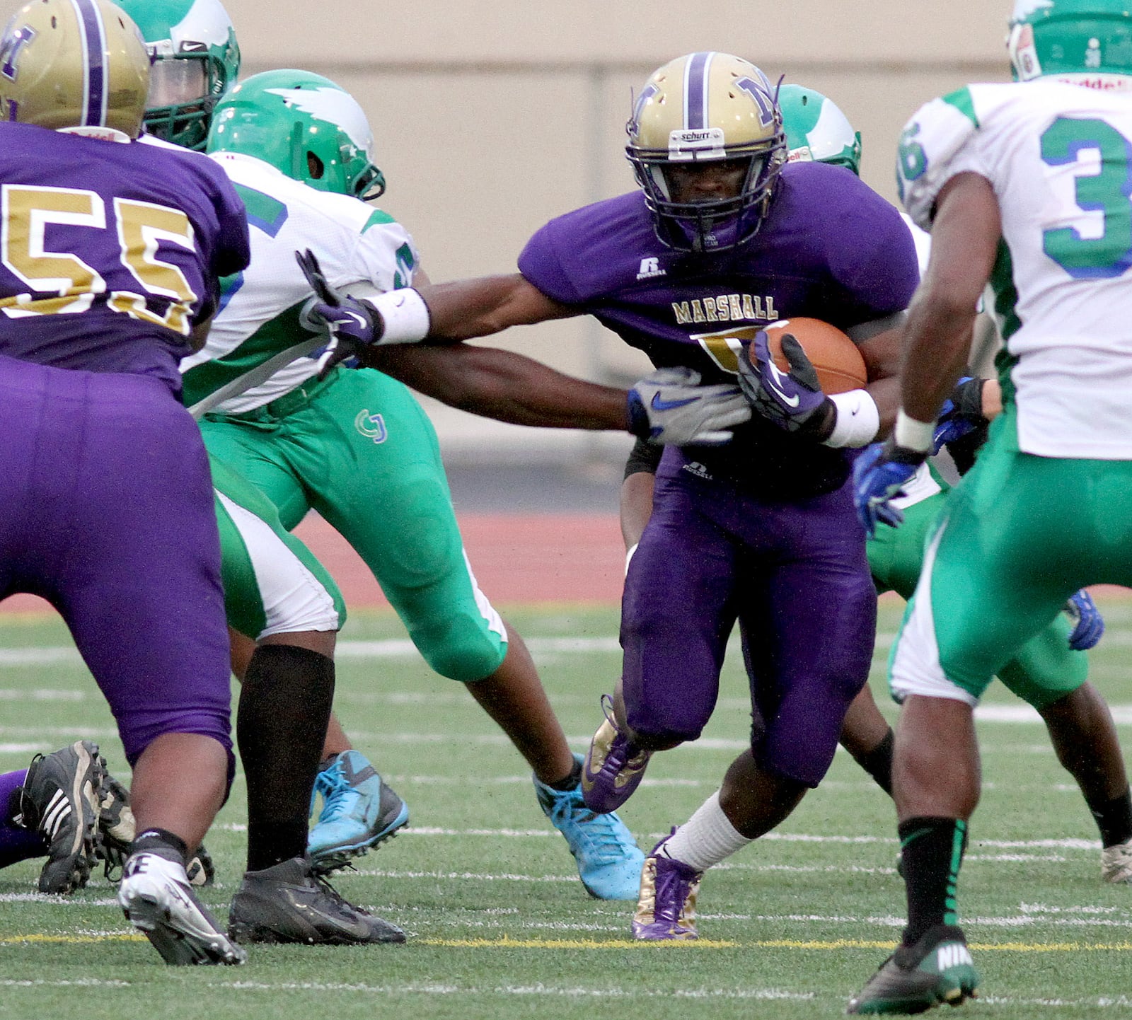 Thurgood Marshall running back Denzel Norvell carries against Chaminade Julienne during their game at Welcome Stadium Friday, August 31, 2012. E.L. HUBBARD PHOTO