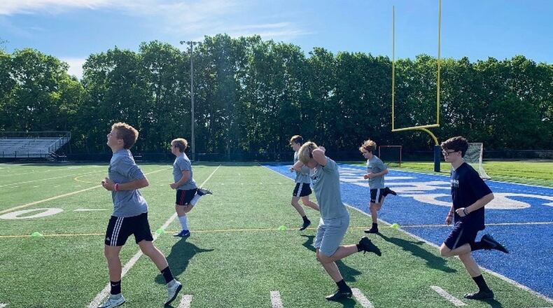 Soccer players at Edgewood High School run on the turf on Tuesday, June 2, 2020, in Trenton. Photo by Greg Brown