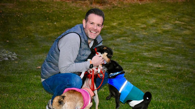 New SICSA CEO Jack Omer has three dogs and two cats. He is shown with rescued and adopted dogs Dottie, Simon (from SICSA) and Molly. CONTRIBUTED