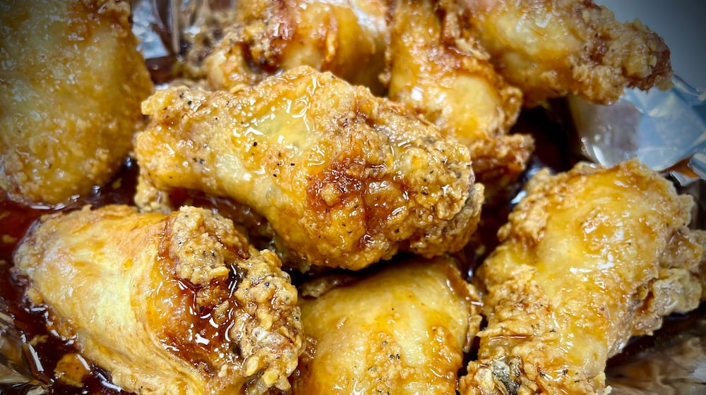 Sourmugs Wings & BBQ is one of six vendors inside The Social at Piqua Center. NATALIE JONES/STAFF