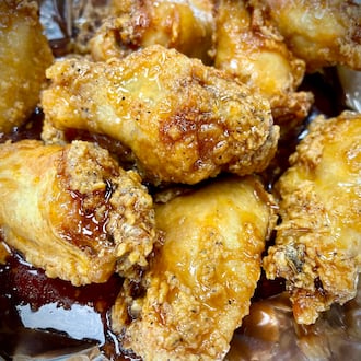 Sourmugs Wings & BBQ is one of six vendors inside The Social at Piqua Center. NATALIE JONES/STAFF