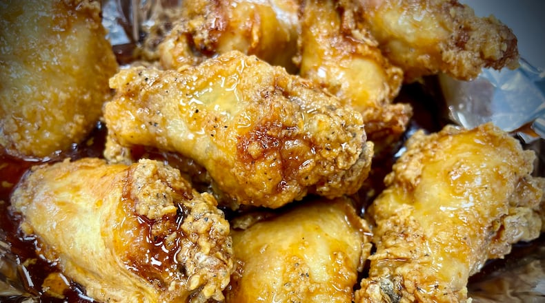 Sourmugs Wings & BBQ is one of six vendors inside The Social at Piqua Center. NATALIE JONES/STAFF