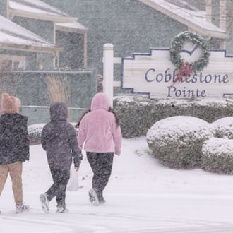 A group of children walk on South Stanfield Road in Troy on Saturday, Dec. 13, 2025. BRYANT BILLING/STAFF