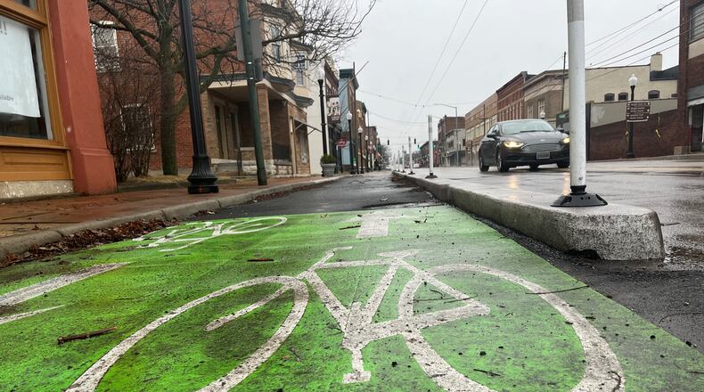 Dayton's two-way cycle track in the Wright Dunbar neighborhood. Dayton expects to construct two more cycle tracks this year. CORNELIUS FROLIK / STAFF