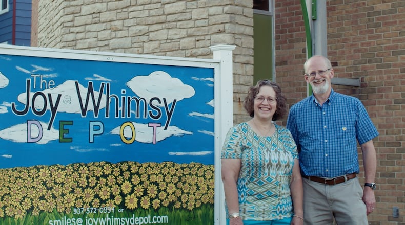 Jane and David Wickham in front of their new business - The Joy & Whimsy Depot - in Lewisburg. The couple's dream finally became a reality on June 5 after more than a year delay due to the COVID-19 pandemic. CONTRIBUTED