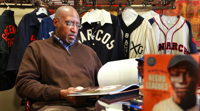 Michael Carter, a senior advisor to the president at Sinclair Community College and the school’s Chief Diversity Officer, with jerseys, memorabilia, and books from the Negro Leagues. Carter is one of the key people putting on Wednesday’s Joe Morgan HBCU Classic matching Wilberforce University’s baseball team against Kentucky State, both Historic Black Universities. FILE PHOTO