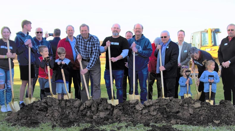 Members of University Baptist Church and local dignitaries break ground on an 18,000-square foot expansion at the church, expected to be completed by over 1,000 volunteers this summer. CONTRIBUTED PHOTO