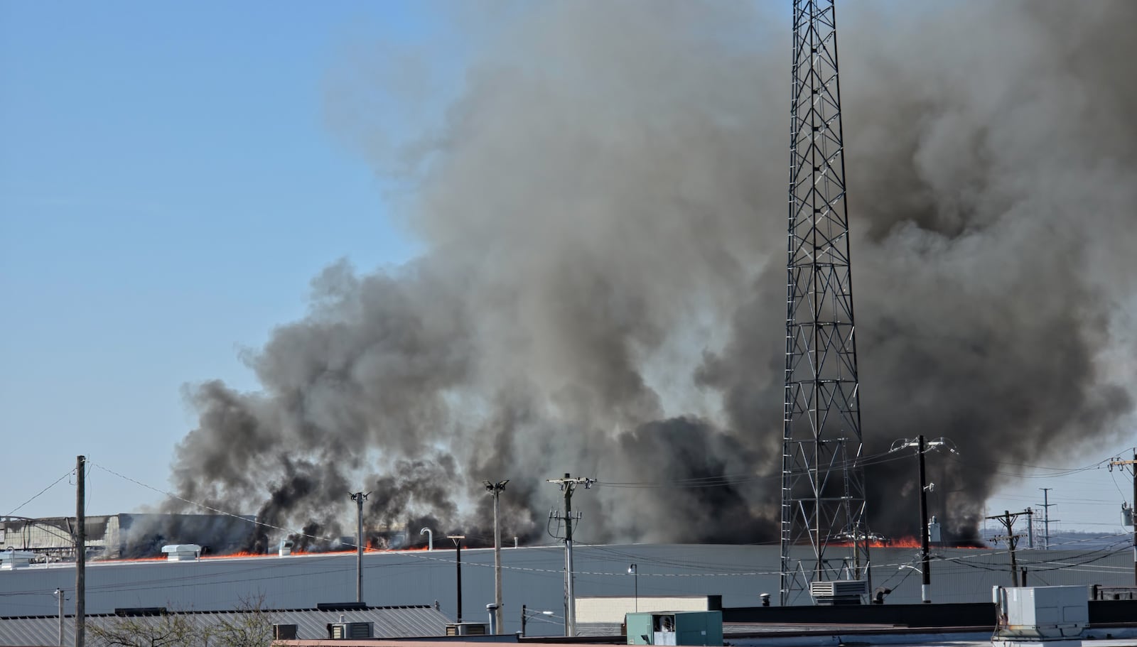 The fire at Fuyao Glass America rekindled shortly before noon on Tuesday, March 24. While firefighters have been working at the site since it first caught fire Sunday night, they had been focusing on hotspots before a large rekindling caused black smoke to rise that was visible for miles. The building that caught fire was Fuyao's coating facility, which was still in the finishing stages of construction. BRYANT BILLING / STAFF
