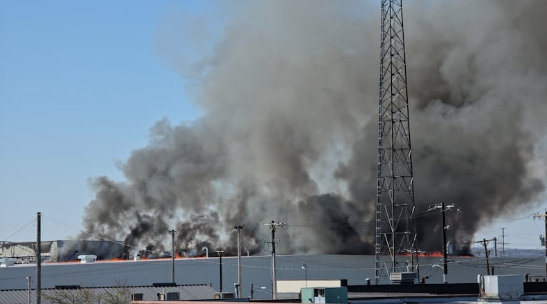 The fire at Fuyao Glass America rekindled shortly before noon on Tuesday, March 24. While firefighters have been working at the site since it first caught fire Sunday night, they had been focusing on hotspots before a large rekindling caused black smoke to rise that was visible for miles. The building that caught fire was Fuyao's coating facility, which was still in the finishing stages of construction. BRYANT BILLING / STAFF