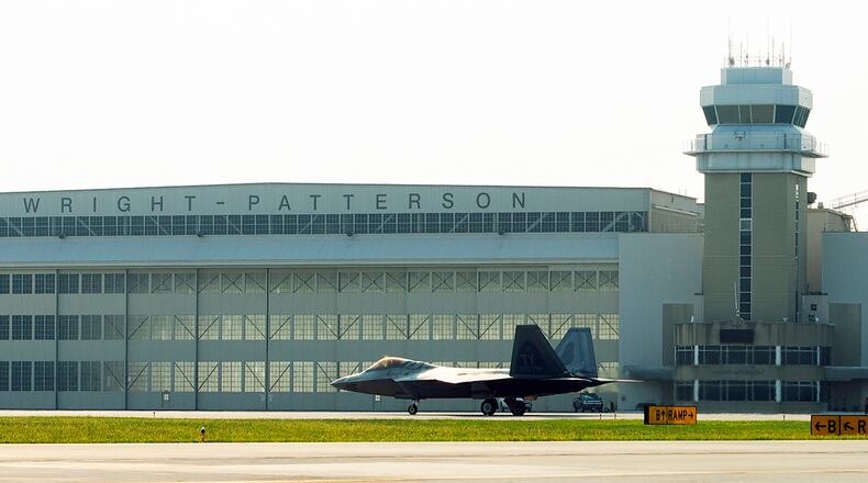 A U.S. Air Force F-22 Raptor with the 325th Fighter Wing taxis past a hangar at Wright-Patterson Air Force Base Aug. 26 prior to heading back home to Eglin AFB, Fla. (U.S. Air Force photo/Airman 1st Class Alexandria Fulton)