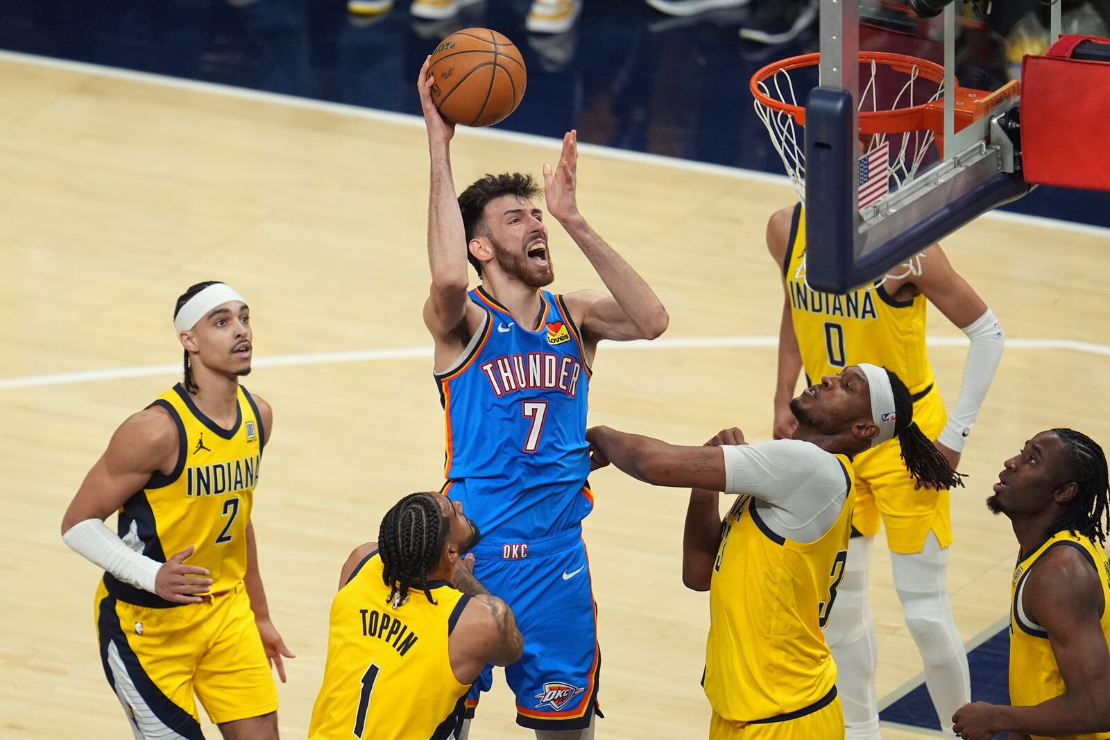 Oklahoma City Thunder forward Chet Holmgren (7) shoots over Indiana Pacers forward Obi Toppin (1) during the second half of Game 3 of the NBA Finals basketball series, Wednesday, June 11, 2025, in Indianapolis. (AP Photo/Michael Conroy)