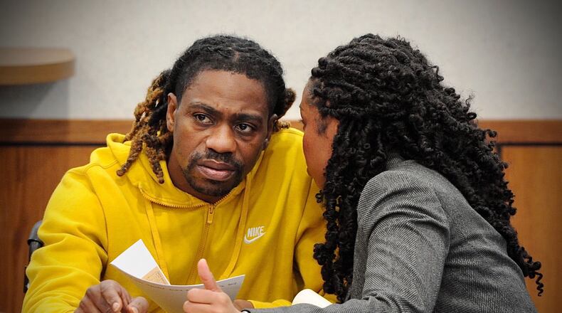 Clifford Owensby talks with his attorney Clarissa Smith during court Monday, Oct. 25, 2021 about the minor traffic misdemeanors of September 30. Owensby was charged for a window tint and seat belt violation. He was found guilty of both traffic violations and fined $150 for each. MARSHALL GORBY\STAFF