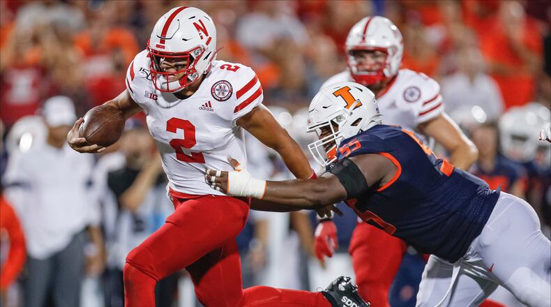 CHAMPAIGN, IL - SEPTEMBER 21: Adrian Martinez #2 of the Nebraska Cornhuskers runs the ball as Jamal Milan #55 of the Illinois Fighting Illini tries to make the stop during the second half at Memorial Stadium on September 21, 2019 in Champaign, Illinois. (Photo by Michael Hickey/Getty Images)