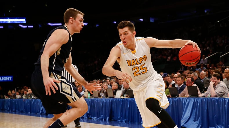 NEW YORK, NY - MARCH 31: Tyler Cavanaugh #34 of the George Washington Colonials guards Alec Peters #25 of the Valparaiso Crusaders during their NIT Championship game at Madison Square Garden on March 31, 2016 in New York City. (Photo by Jeff Zelevansky/Getty Images)