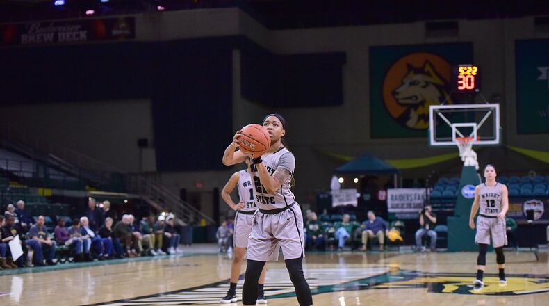 Senior guard Chelsea Welch prepares to shoot the free throw that netted her 1,000th point at Wright State during Monday afternoon at the Nutter Center against Youngstown State.