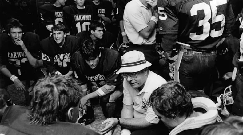 Howard “The Hat” Sales surrounded by his Oakwood High players at a game (Contributed Photo)